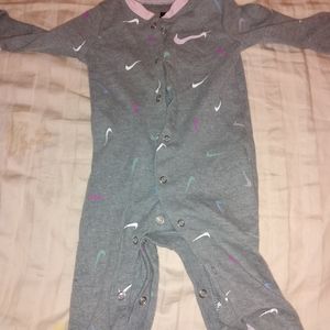 Nike footie pajamas for 3 Month old. Gray with white and pink Nike signs.